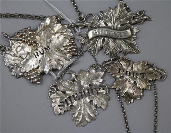 Four William IV/Victorian silver vine leaf wine labels